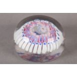 A LATE 19TH/EARLY 20TH CENTURY GLASS PAPERWEIGHT, probably Clichy, having a central cane within