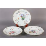 A SET OF THREE MEISSEN CABINET PLATES, writhen and basket weave moulded and polychrome painted