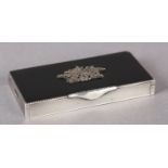 A GEORGE V SILVER, ENAMEL AND MARCASITE COMPACT CASE, the rectangular black champlevé top set to the