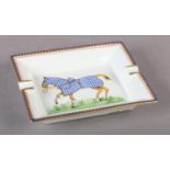 A HERMES PORCELAIN ASHTRAY, polychrome printed with a race horse, orange, blue and gilt zigzag