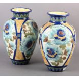 A PAIR OF BURMANTOFT FAIENCE VASES, of ovoid outline enamelled and moulded with large flower heads