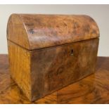 A 19TH CENTURY FIGURED WALNUT DOME TOP TEA CADDY, internally fitted with two lidded compartments,