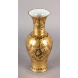 A FRENCH PORCELAIN VASE, the gilt ground painted in black with ribbon-tied musical instruments and