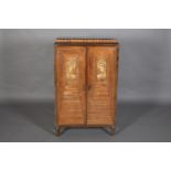 A FRENCH ART DECO WALNUT AND MARBLE TWO DOOR CABINET having a walnut and ivory inlaid tablet frieze,