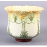 A BURMANTOFT FAIENCE JARDINIERE, enamelled and moulded with long stemmed plant forms in