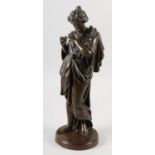 A 19TH CENTURY BRONZE FIGURE OF A CLASSICAL FEMALE, standing, playing a flute, on circular plinth,