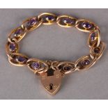 A VICTORIAN AMETHYST BRACELET in 9ct rose gold, each hollow curb link collet set to the centre