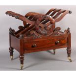 A REGENCY ROSEWOOD CANTERBURY, of laurel wreath and X design, having three divisions above a drawer,