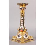 A ROYAL CROWN DERBY CANDLESTICK, pattern no 1128; moulded sconce and column on a square foot with