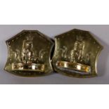 A PAIR OF LATE 19TH CENTURY BRASS WALL SCONES, the shield shape back embossed with a crowned