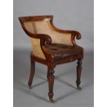 A 19TH CENTURY MAHOGANY AND BERGERE CANED LIBRARY CHAIR with brown buttoned leather squab cushion,