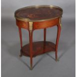 A FRENCH CHINOISERIE MAHOGANY AND GILT METAL MOUNTED TABLE of oval outline with three quarter