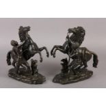 AFTER GUILLAME COUSTEAU, A PAIR OF BRONZE MARLY HORSES AND ATTENDANTS, on naturalistic base, both