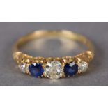 AN EDWARD VII SAPPHIRE AND DIAMOND FIVE STONE RING in 18ct gold, the graduated Old European cut