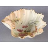 A ROYAL WORCESTER SHELL SHAPED DISH, the blush ivory ground, printed gilt and enamelled with