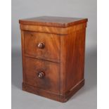 A VICTORIAN MAHOGANY BEDSIDE CABINET, having a single door cupboard above a deep drawer, turned