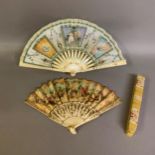 A small bone late 19th century/early 20th century gilded bone fan mounted with the known printed