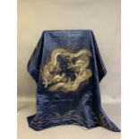 A large Chinese silk hanging or cover, Qing Dynasty, the ground in deep blue silk, embroidered