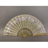 A light and airy early 20th century fan, the monture of pale horn, gilded and silvered, the cream