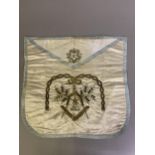 An early 19th century French masonic apron, cream silk embroidered in chenille and metal thread,