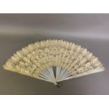 Maltese Lace: a large and showy white mother of pearl fan mounted with a deep handmade Maltese