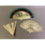 A dainty early 20th century painted bone brisé fan, with central cartouche and two side ovals,