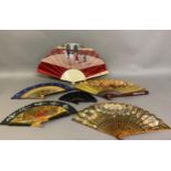 A good, large c 1890’s bone fan, mounted with a deep silk leaf, painted with an informal gathering