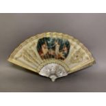 A Regency period white mother of pearl fan, the monture decoratively gilded, the upper guards carved