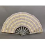 A French silk “Trick” fan or eventail à dislocation, the complex bands of alternating cream or lilac