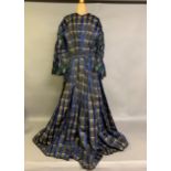 A tartan silk dress c 1850’s, long pagoda sleeves, gathered and shaped, lined in cream glazed
