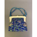 A 20th century Chinese evening bag, the frame of either bone or thick celluloid, the bag itself made