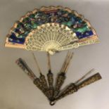 Two 19th century Chinese fans, Qing Dynasty, the first with carved and pierced bone monture fitted