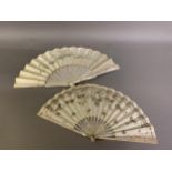 Two mother of pearl fans, the first c 1910, the monture pink, the cream silk leaf backed with