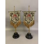 A matching pair of standing face screens or table/mantle fans, in banner form, Berlin woolwork