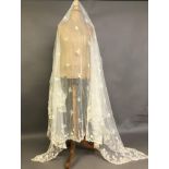 A Honiton bobbin appliqué rectangular wedding veil, 1880’s – 1900, approx. 210cm by 190cm, with