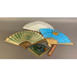 A painted wood brisé fan c 1880’s, the upper section pierced, the centre painted with forget-me-nots