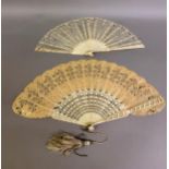 A 19th century bone Jenny Lind fan with elaborately carved gorge, designed with concentric bands