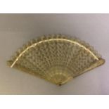 A good early 19th century pale horn brisé fan, barrel head, shaped tips, the main body of the fan