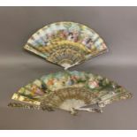 Two mid-19th century mother of pearl fans, both carved, pierced and gilded, the first contained in a