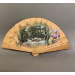 A late 19th century wood brisé fan, with a central applied scenic panel of a rural bridge and