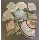 Eight European lace bonnets, mainly 19th century and mainly knitted, four incorporating tiny beads