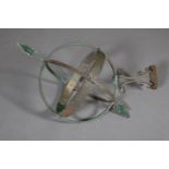 A metal armillary sphere and bracket