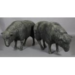 A pair of sheep, realistically modelled in fibre glass, approximately 60cm high x 90cm long (one