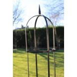 A black wrought iron plant stand, 215cm high