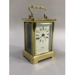 Worcester brass carriage clock with both Roman and Arabic numerals measuring 14.5cm, with key