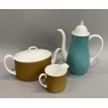 A Susie Cooper amber fan shaped teapot and milk jug, pattern number C2055, together with a 1950s