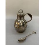 A 20th century silver Jersey cream jug with Hallmarks for the island of Guernsey .925 silver