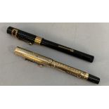 A 'Royal' vintage black cased fountain pen and a vintage rolled gold cased fountain pen both with