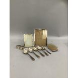 Two silver rectangular photograph frames, two silver napkin rings engraved Margaret and Eric, four