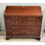 A George III mahogany bureau having a fall front with fitted interior over two short and three